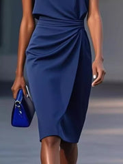 Navy ruched sheath dress with a keyhole neckline and tulip hem, 100% polyester.