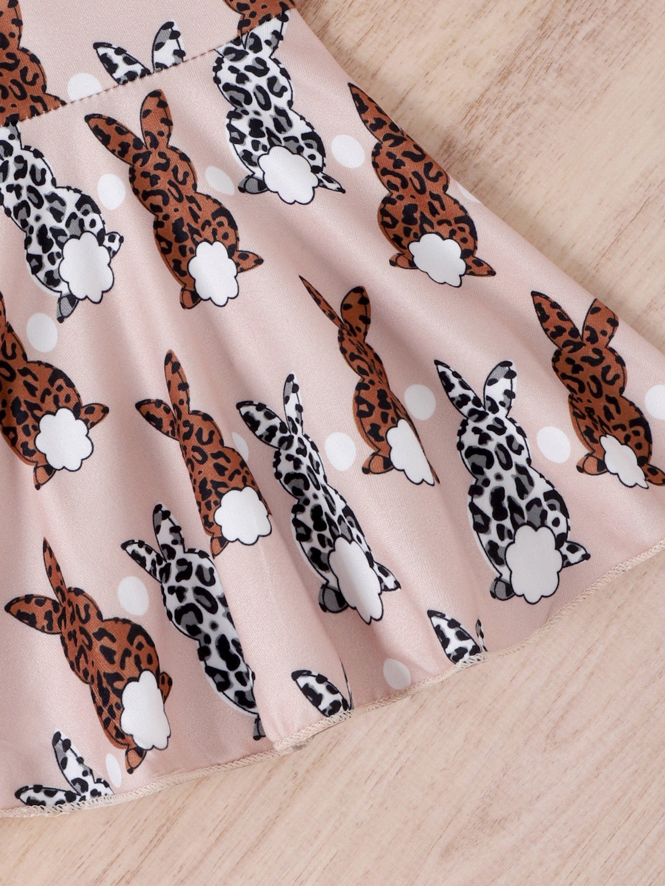 Girls' underwear with a pink background and a pattern of leopard print Easter bunnies and white polka dots.