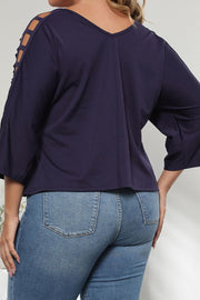 Dark navy v-neck blouse with lattice detail on the sleeves and 3/4 length sleeves.