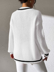 White ribbed knit sweater with black varsity trim on neckline and hem.