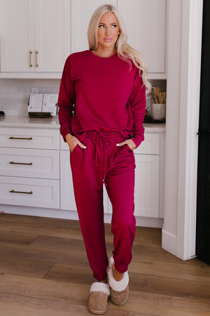 Plush lounge set in Deep Rose, featuring relaxed fit joggers with a drawstring waist and a crewneck sweatshirt.
