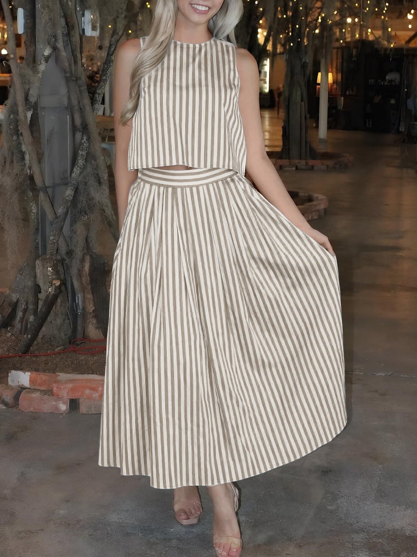 Buttoned two-piece set in khaki stripe with crop top and pleated midi skirt.