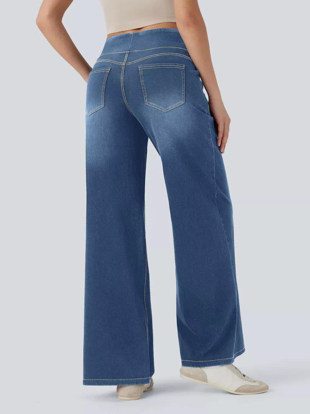 Maternity wide-leg jeans in medium dark blue denim with contrast stitching and back pockets.