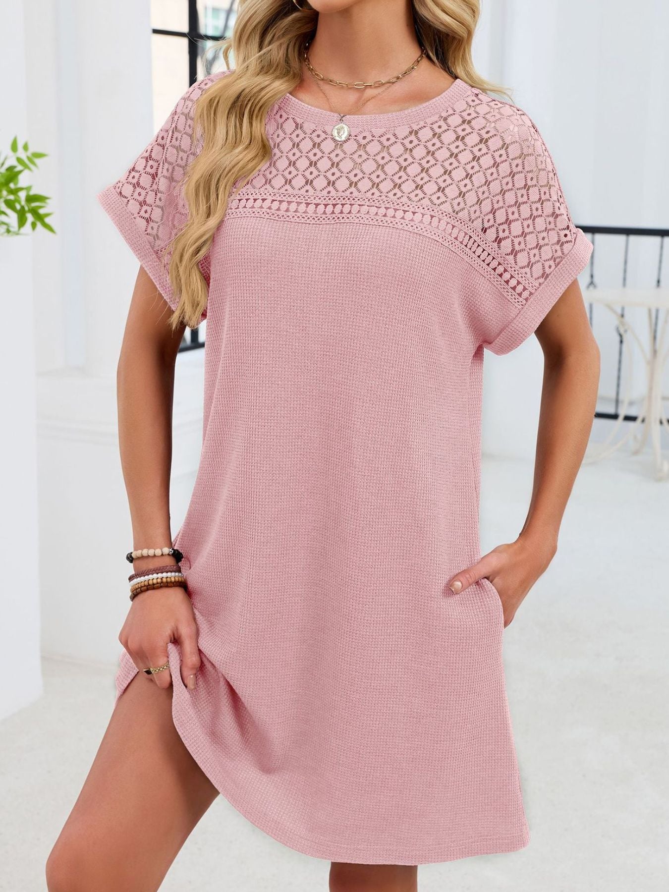 Blush pink t-shirt dress with sheer lace yoke and short sleeves.