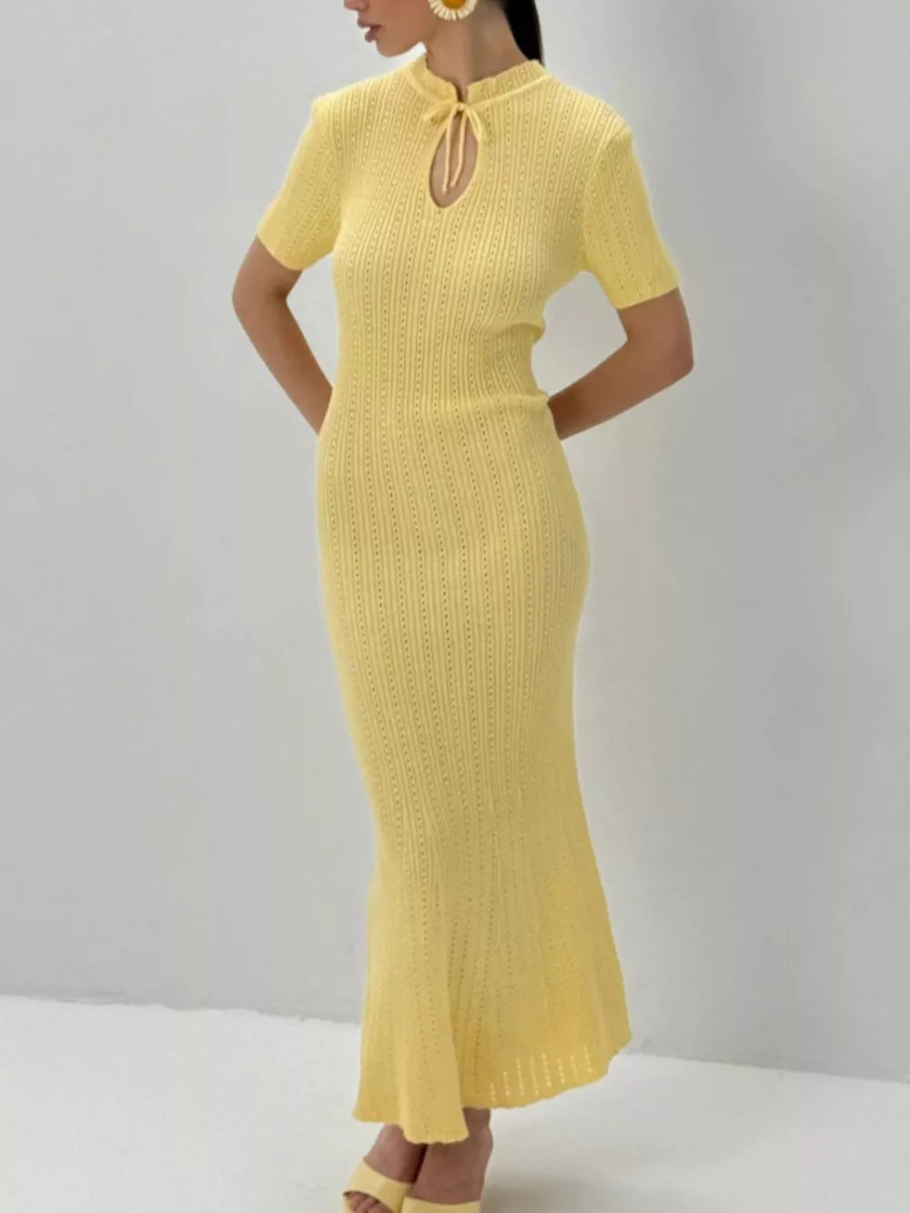 Pastel yellow knitted mermaid dress with short sleeves and tied neckline detail