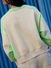 Chic Contrast Sleeve Sweater 3 in beige with gum leaf green colorblock sleeves and crewneck.