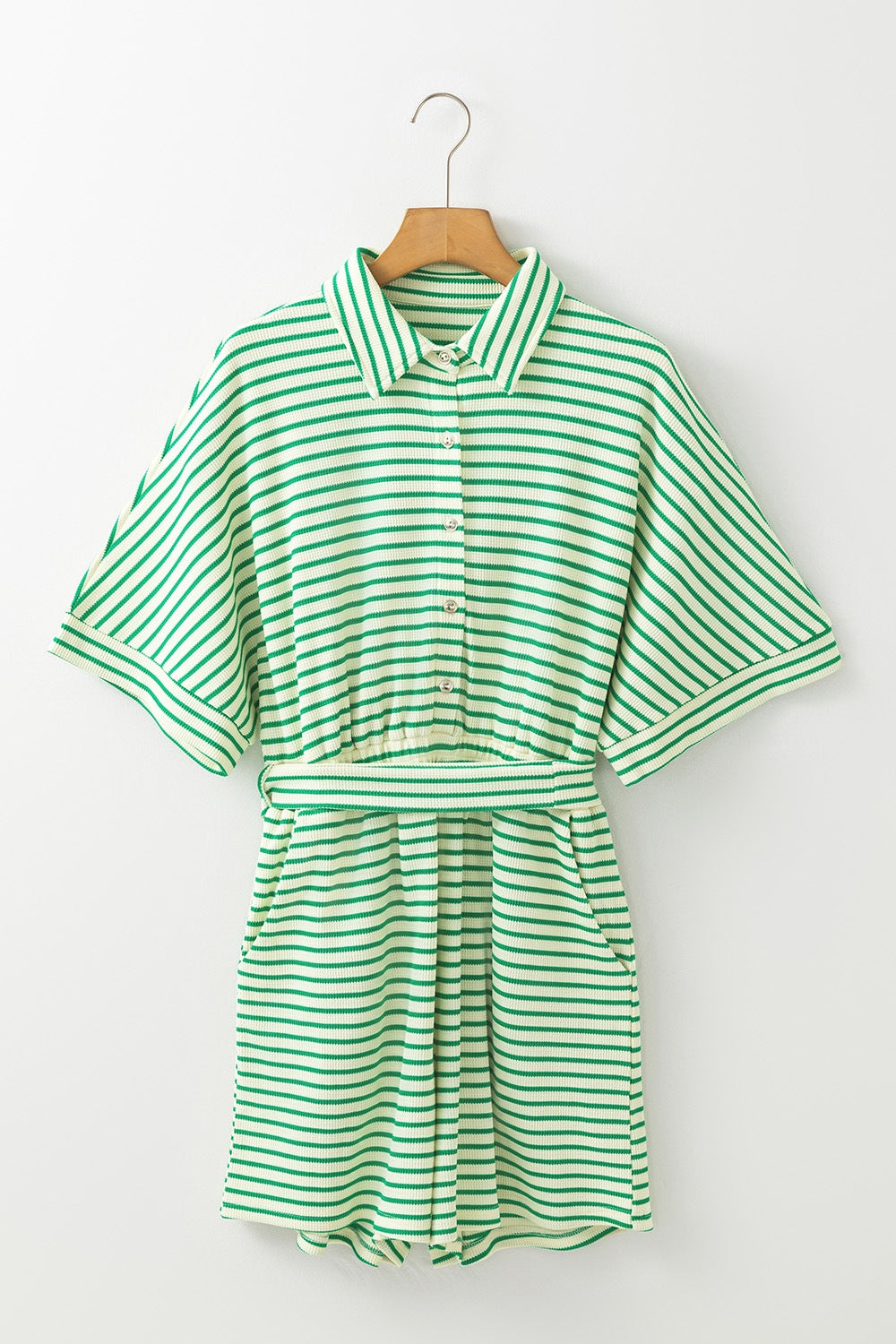 Green striped resort shirt romper with tie waist and buttoned front.