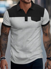 Colorblock waffle knit polo shirt with chest pocket detail in gray and black.