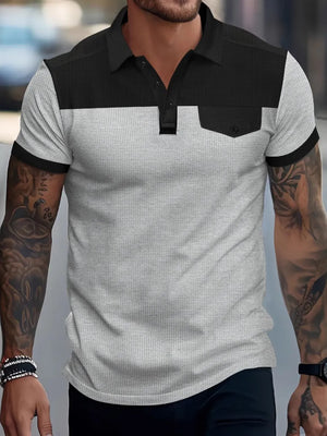 Colorblock waffle knit polo shirt with chest pocket detail in gray and black.