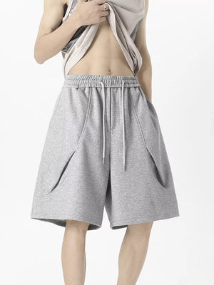 Grey men's sweat shorts with drawstring waist and angled pockets