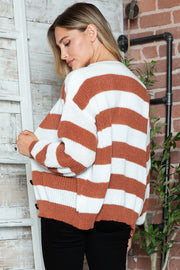 Chunky stripe cardigan in brown and white acrylic with balloon sleeves and buttons.