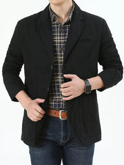 Black cotton button-up blazer with a plaid shirt and jeans.