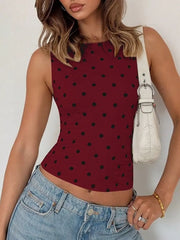 Wine red polka dot tank top with a cropped fit and round neckline.
