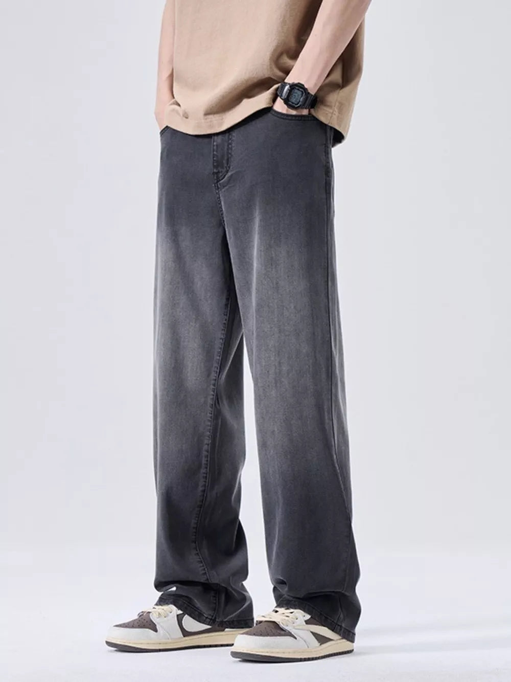 Men's relaxed fit sweatpants in a vintage-washed soot grey with a faded effect.