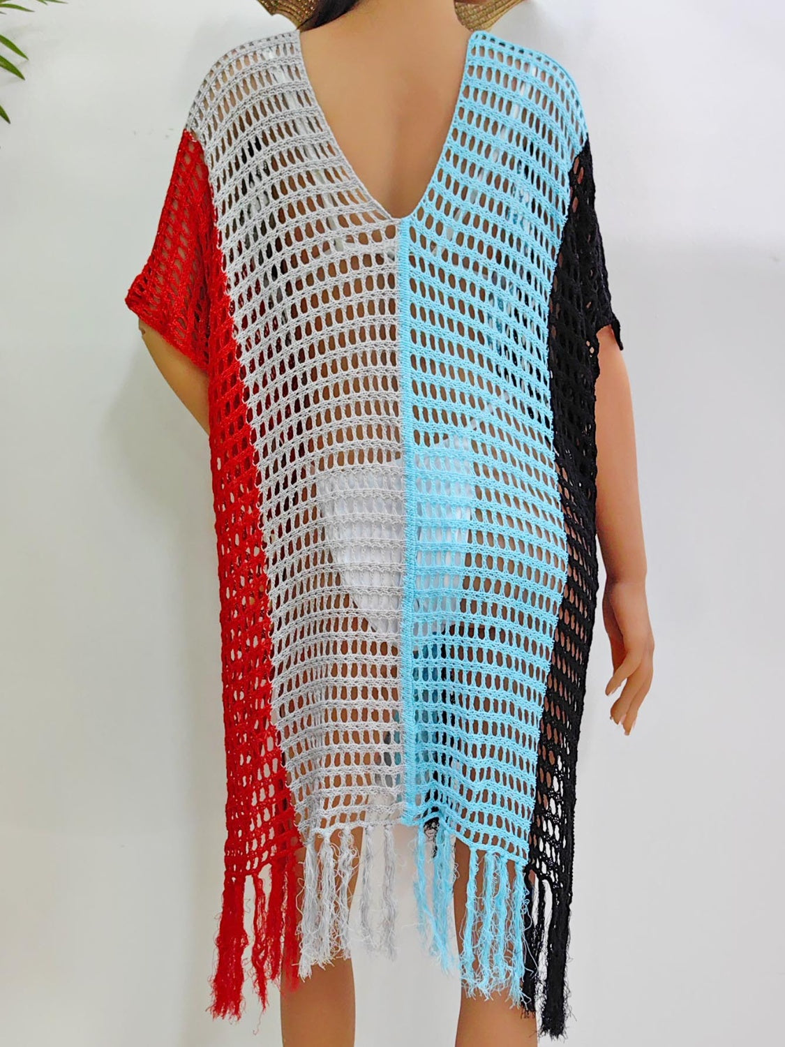 Colorblock crochet cover-up with fringe, V-neck, short sleeves in red, grey, blue, and black.