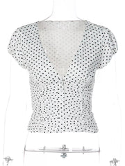 White polka dot ruched V-neck t-shirt with short sleeves and button front.