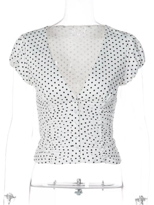 White polka dot ruched V-neck t-shirt with short sleeves and button front.