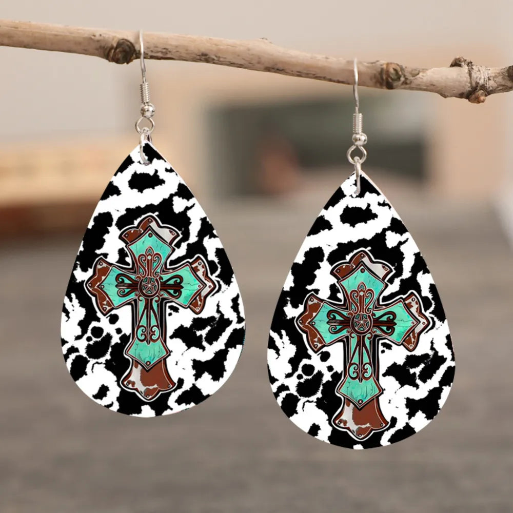 Teardrop earrings with cowhide print and turquoise cross detail