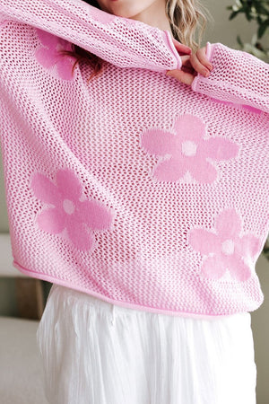 Openwork blush pink acrylic sweater with floral intarsia pattern and crew neck.