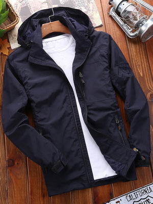 Men's navy blue lightweight hooded jacket with zip pockets and a casual fit.