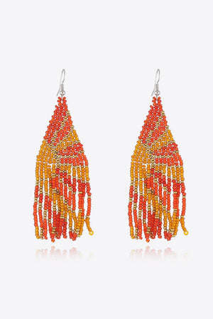 Women's chic bead drop earrings in orange and gold gradient with fringe detail