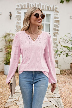 Blush pink eyelet yoke blouse with blouson sleeves and v-neckline
