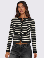 Black and white striped cropped cardigan with gold buttons and pockets.