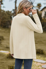 Cream textured open-front drape cardigan with long sleeves and a mock neckline.