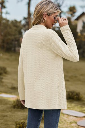 Cream textured open-front drape cardigan with long sleeves and a mock neckline.