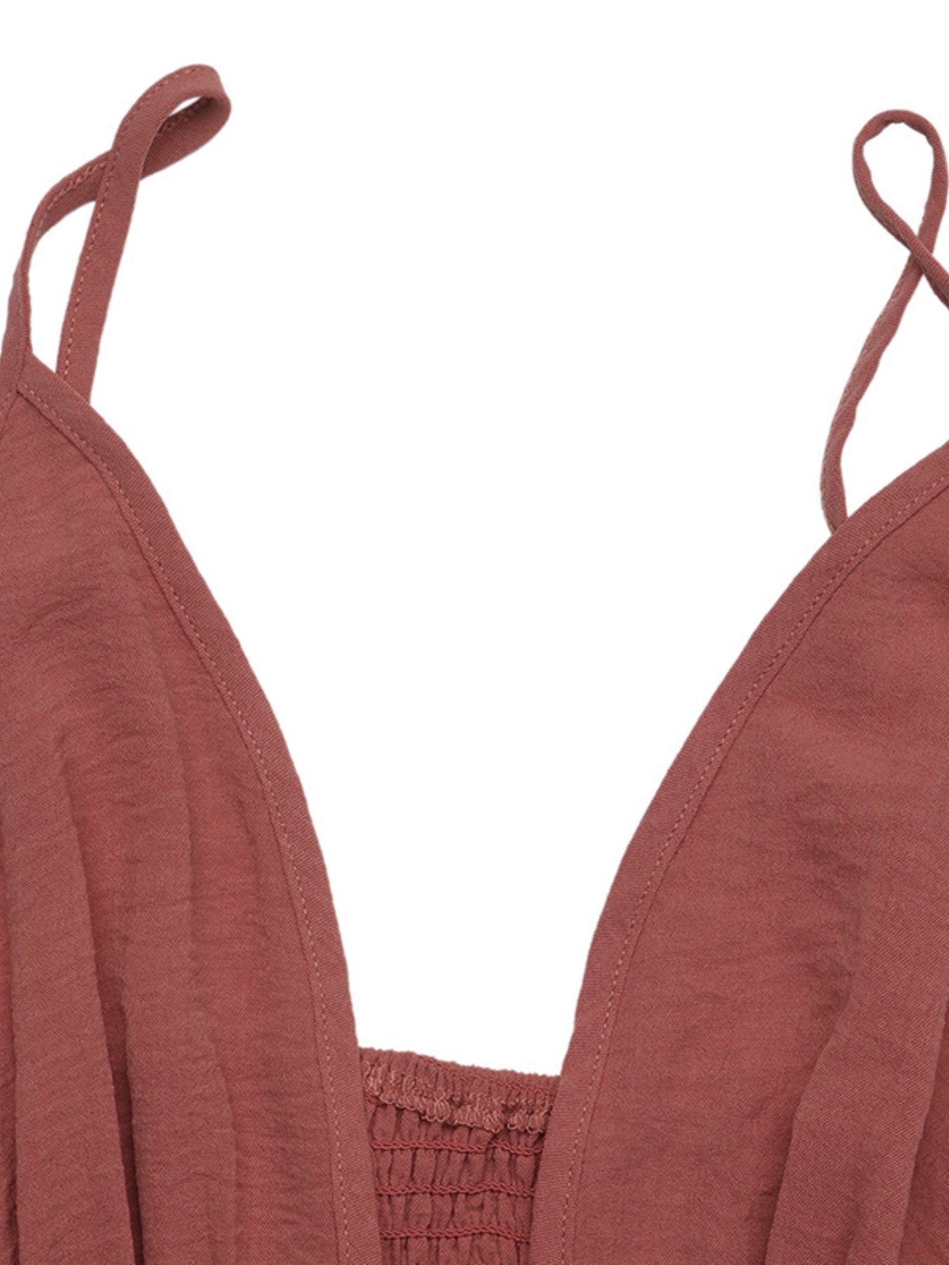 Plunging V-neck maxi dress in rust with smocked bodice and spaghetti straps.