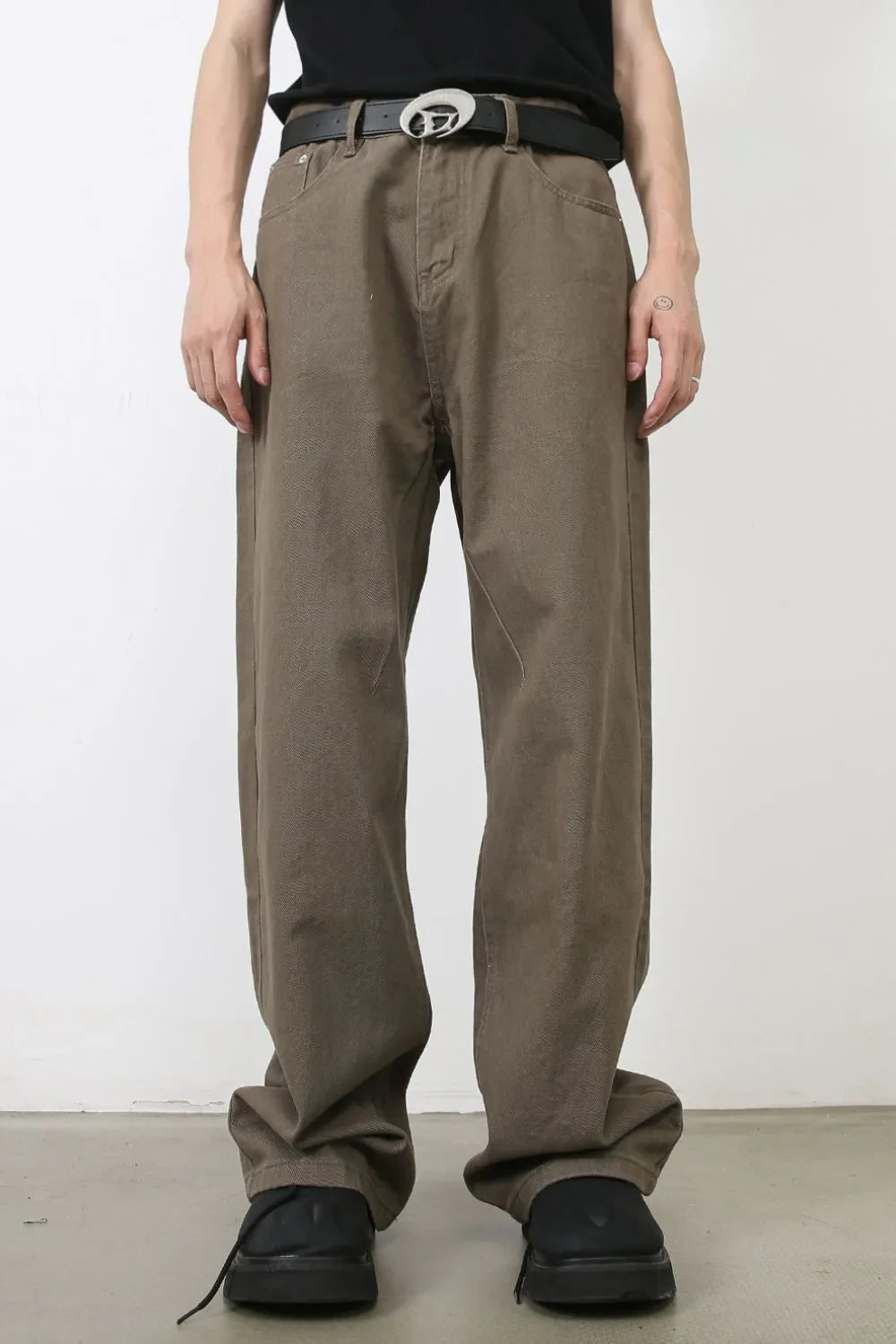 Taupe wide-leg denim trousers with a relaxed fit and casual styling.