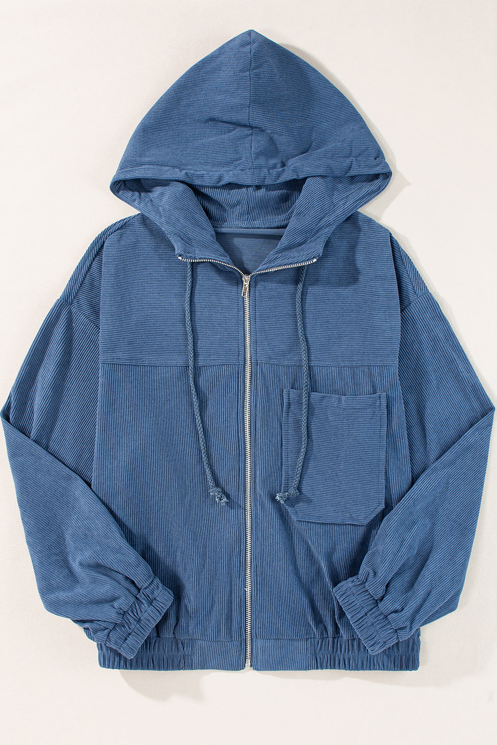 Dusty blue corduroy bomber hoodie with zip front, drawstring hood, and chest pocket.