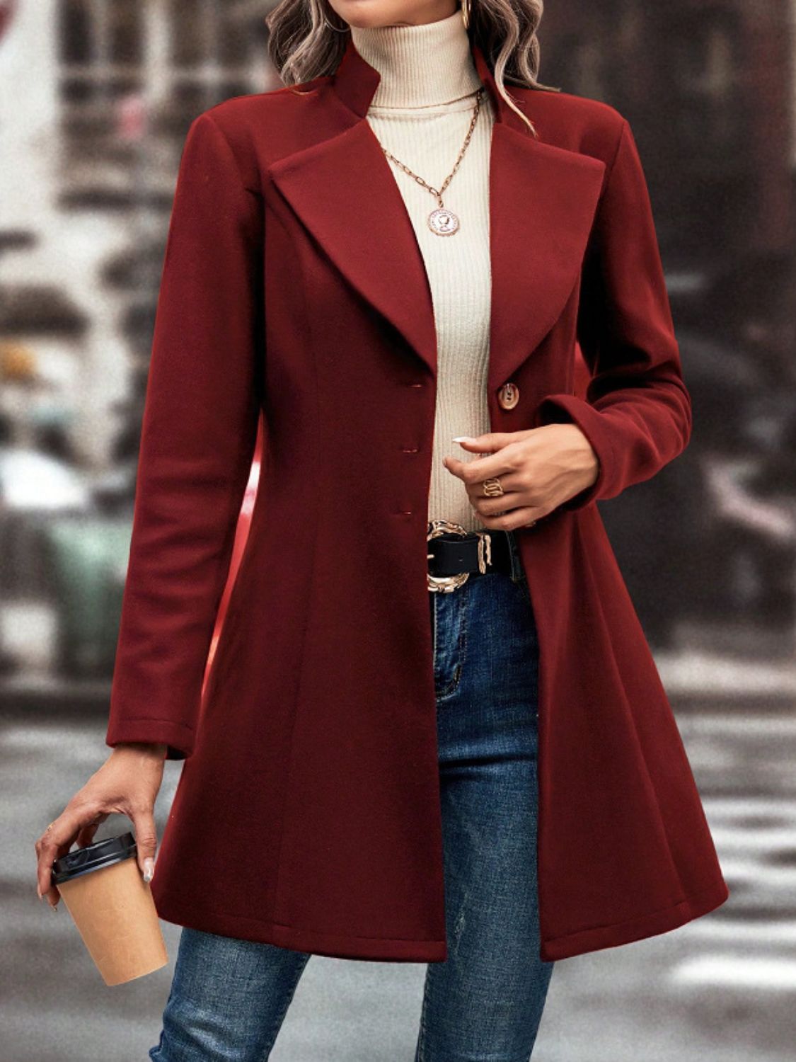 Burgundy wool coat with flared hemline, button closure, and notched lapels.