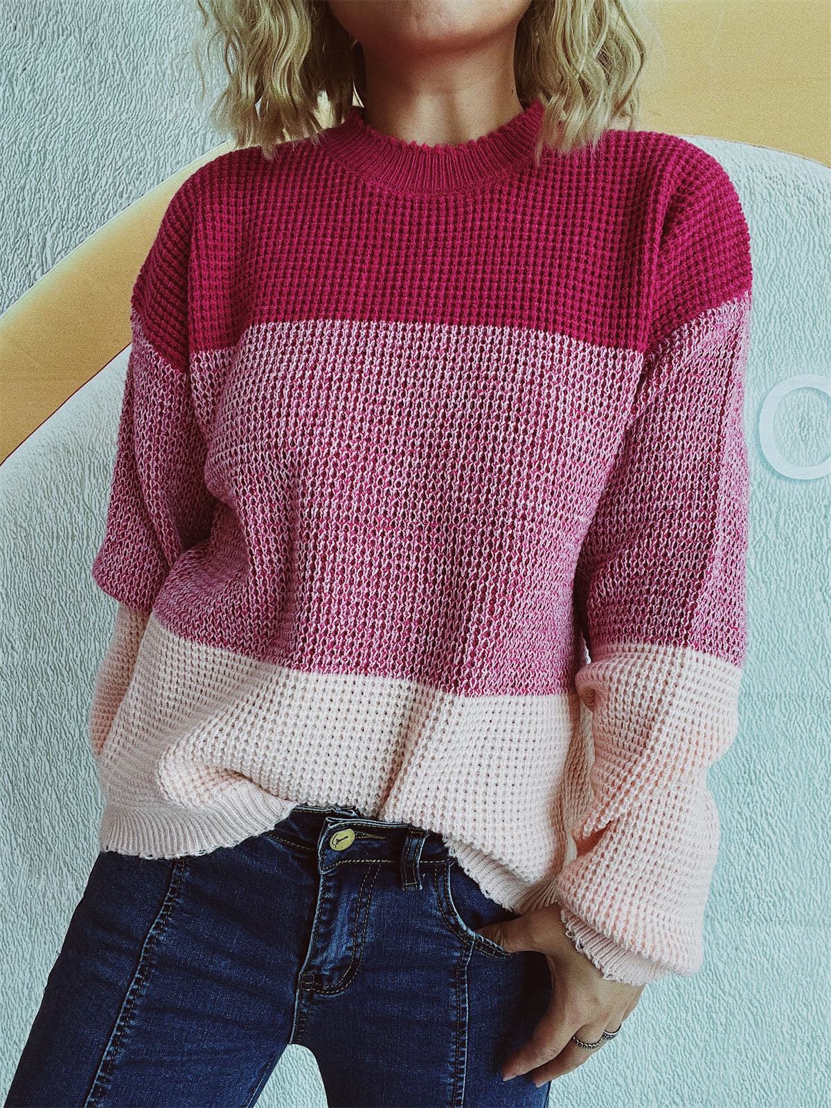 Colorblock textured knit pullover sweater in pink and magenta with crew neck.