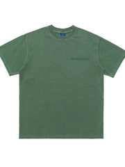 Green oversized graphic tee with a small chest graphic and crew neck.
