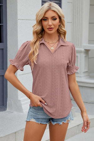 Blush pink eyelet polo blouse with short ruched sleeves.