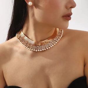 Gold-plated pearl choker necklace and stud earrings with crystal accents.