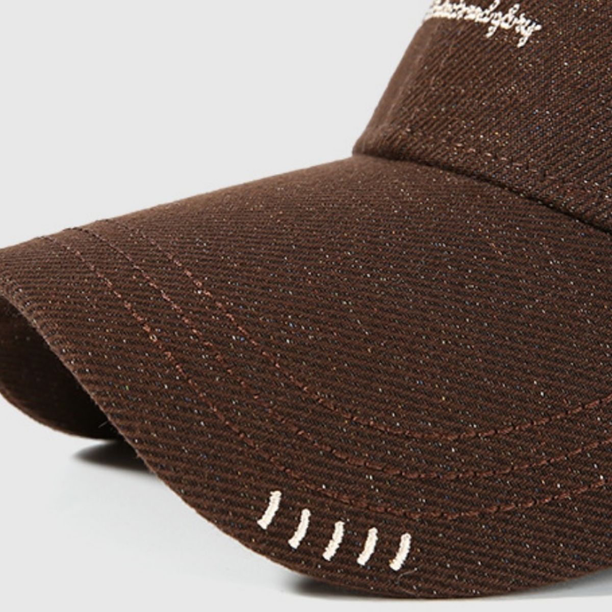 Brown cotton baseball cap with embroidered detail and contrast stitching