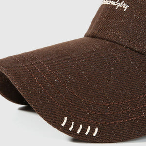 Brown cotton baseball cap with embroidered detail and contrast stitching
