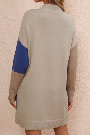 Geometric colorblock knit mini dress with mock neck and ribbed hem, featuring camel, blue, and brown panels.