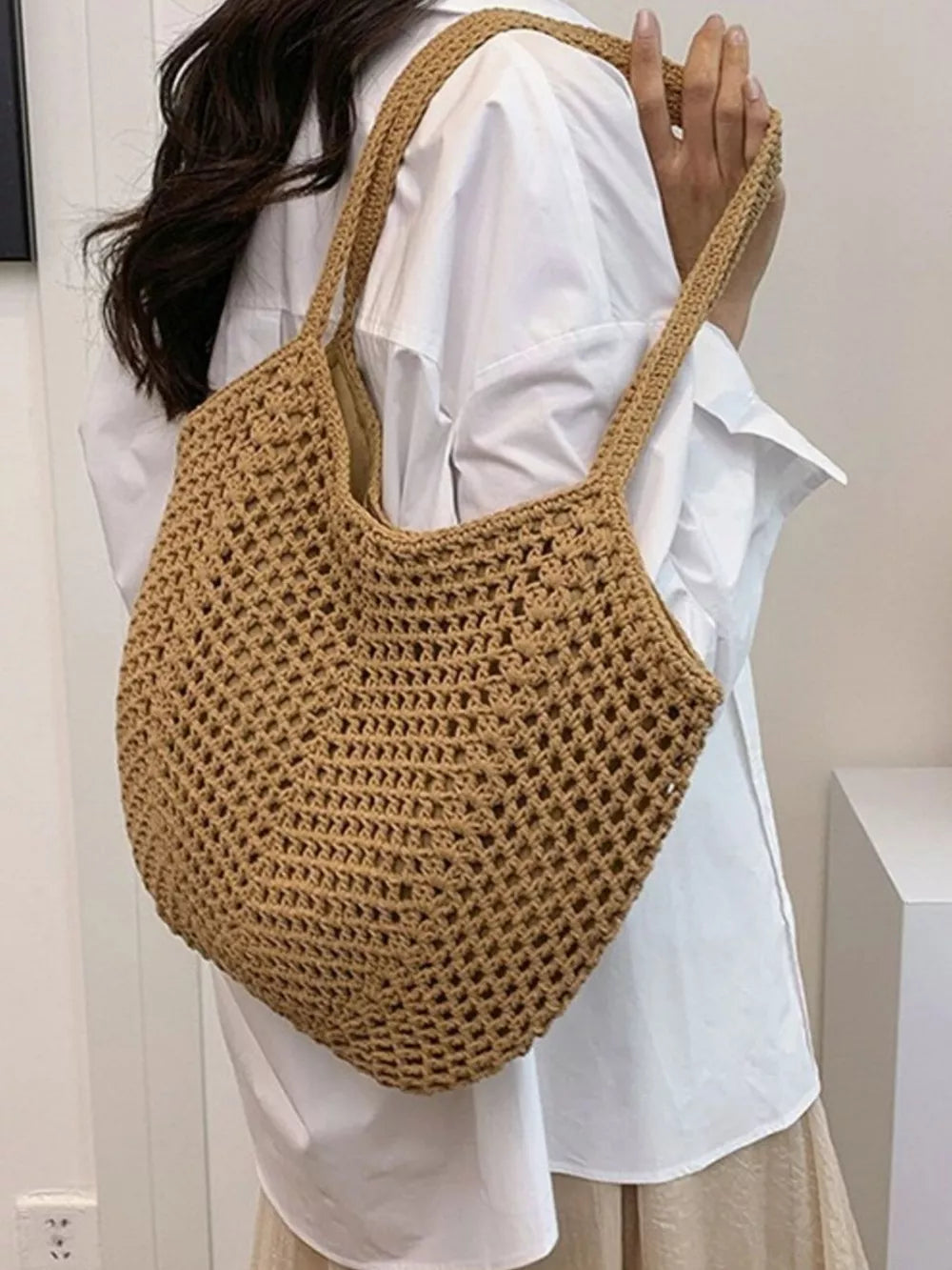 Chevron woven straw shoulder bag in Khakis with braided straps and open crochet detail.