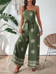 Matcha green bandeau jumpsuit with embroidered floral pattern and wide legs.