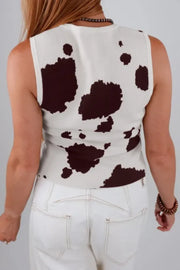 Chic cow print sweater vest with crew neck and sleeveless design.