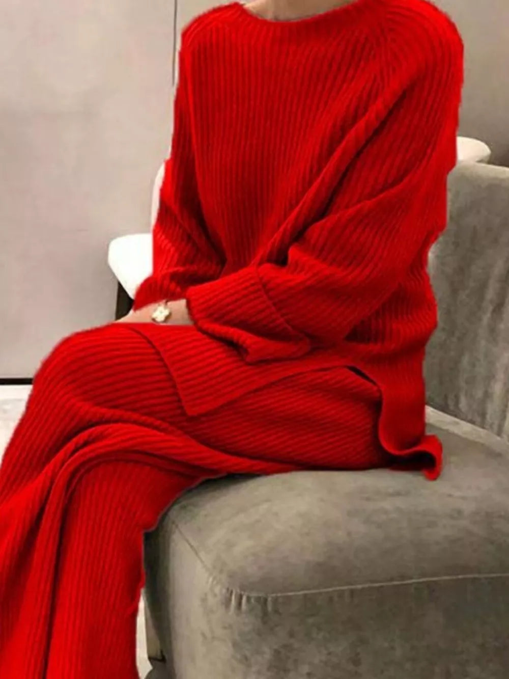 Red ribbed knit sweater and pants set with crew neck and long sleeves.