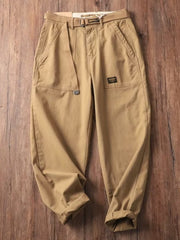Men's tan loose fit cargo pants with belt and pockets