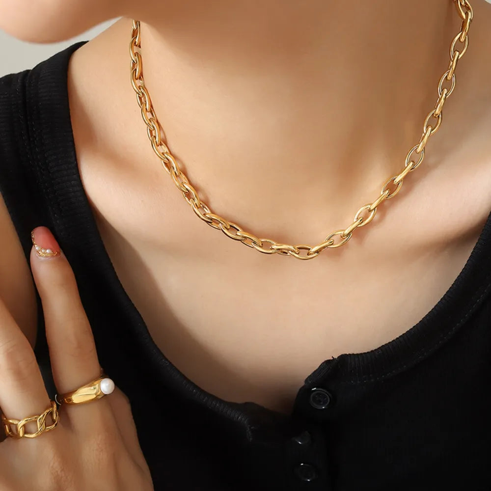 Chunky gold-tone oval link necklace with a bold, casual style.