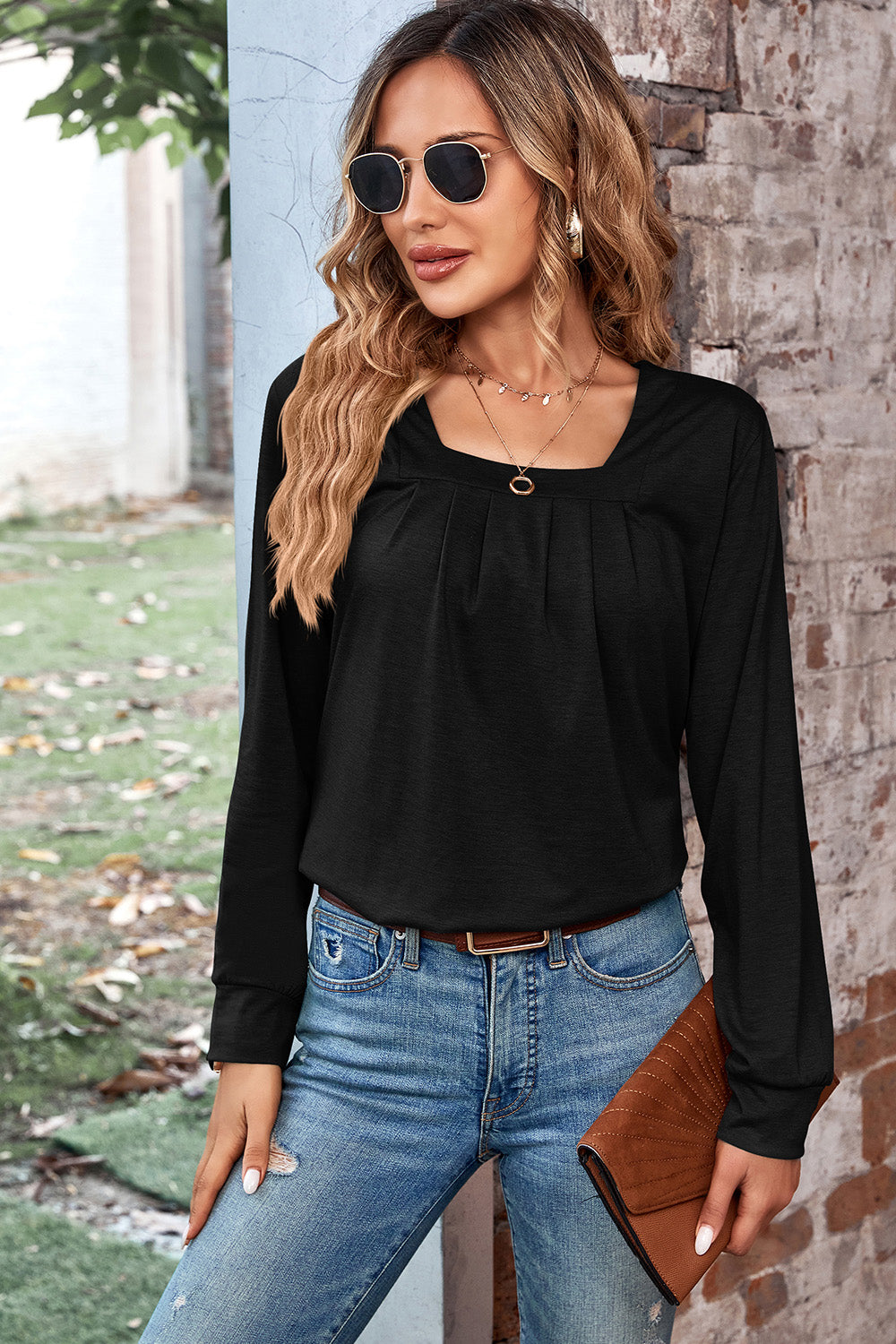 Black long sleeve top with square neckline and pleated detail