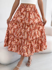 Romantic floral midi skirt in orange with ruffle tiers and hem.