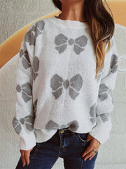 White acrylic sweater with allover gray bow print, crew neck, and relaxed fit.