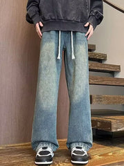 Men's blue wide leg jeans with drawstring waist and faded wash